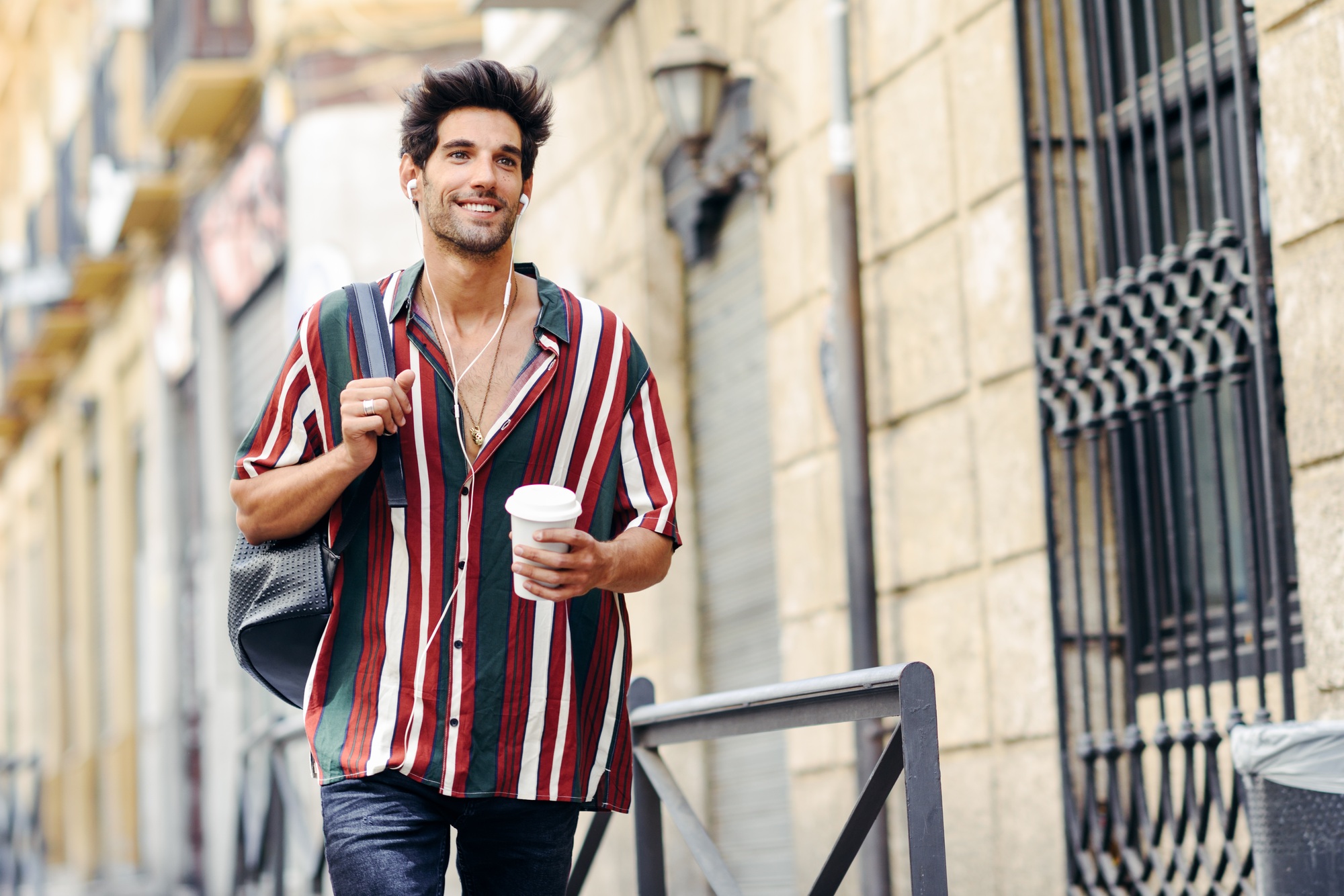 Young male traveler enjoying the streets of Granada, Spain