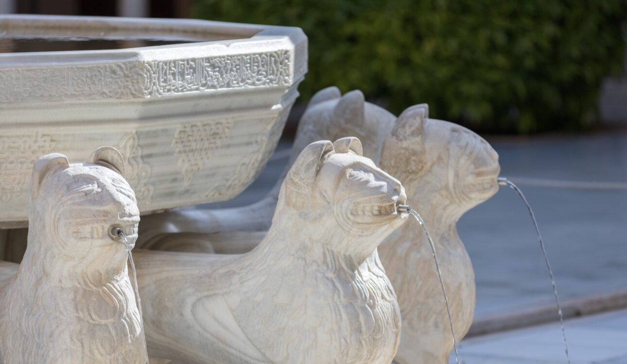 Granada, Spain - May 10, 2018: fountain of lions within the city of the Alhambra
