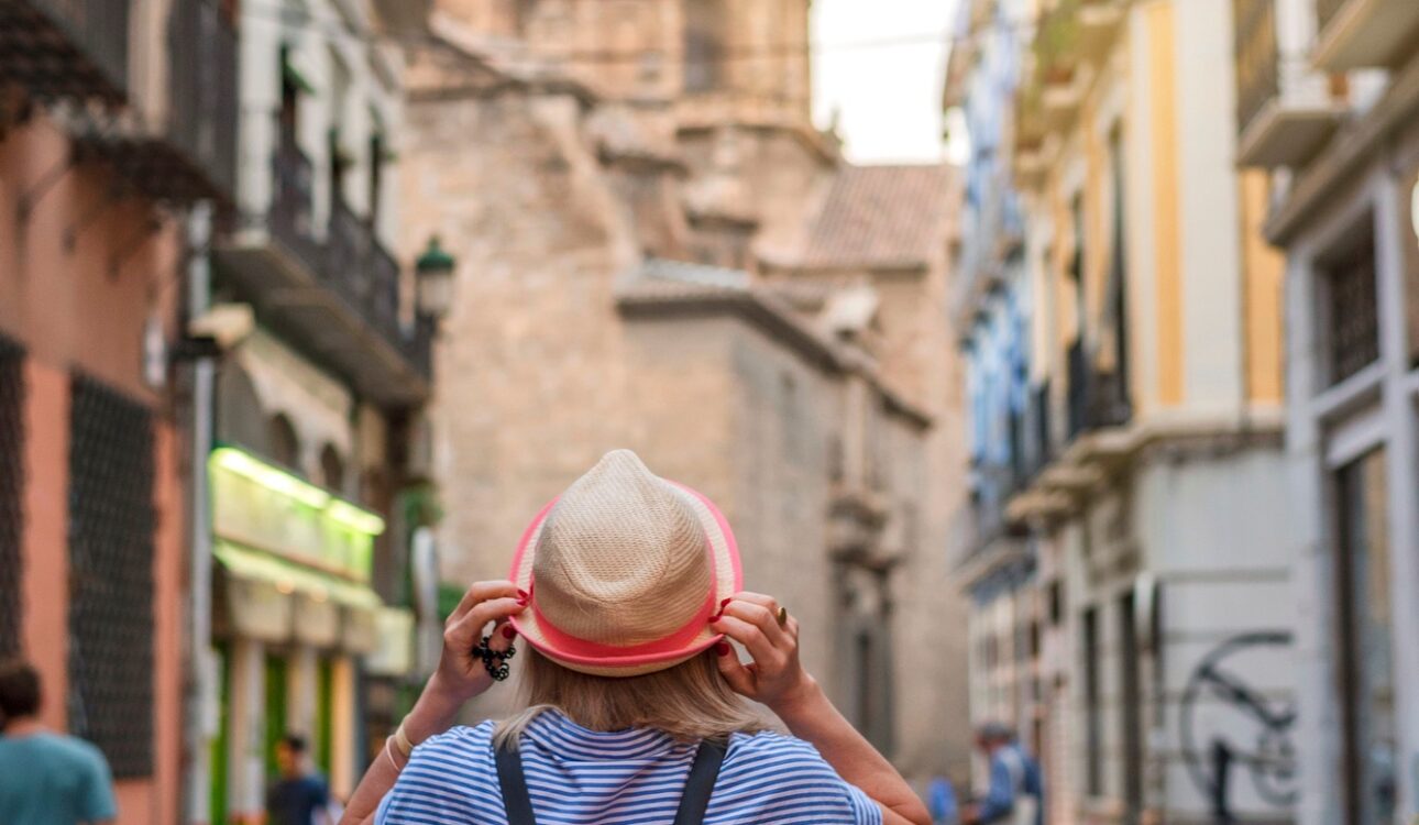 Woman tourist walking in old town of Granada Spain, travel concept. Travel alone
