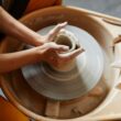 Female Hands Shaping Ceramics on Pottery Wheel